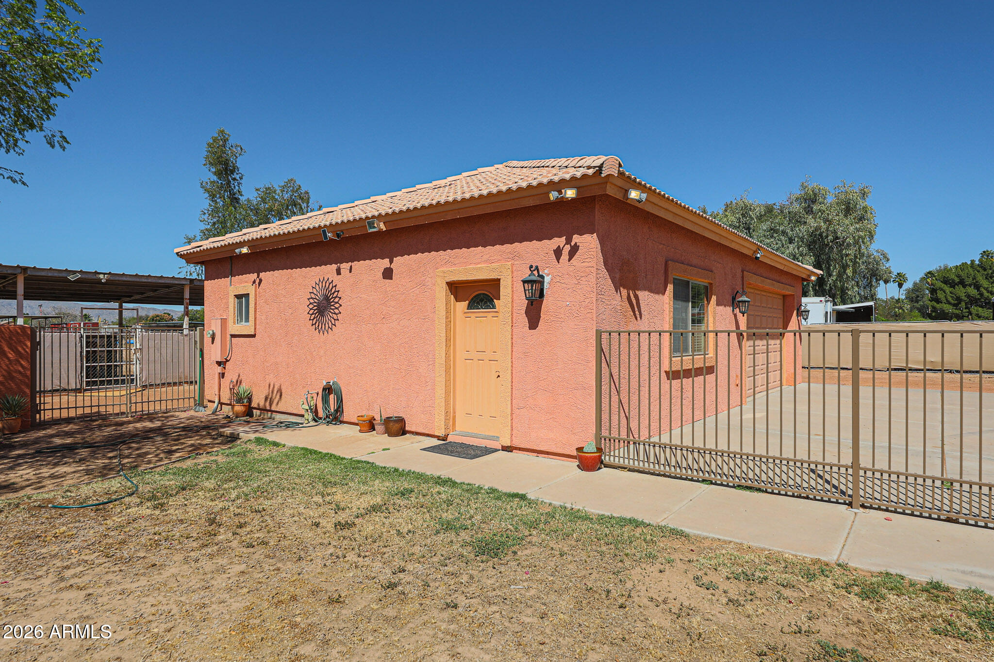 7344 North Alsup Road Litchfield Park, AZ 85340 - Photo 43 of 62 a view of a house with wooden fence