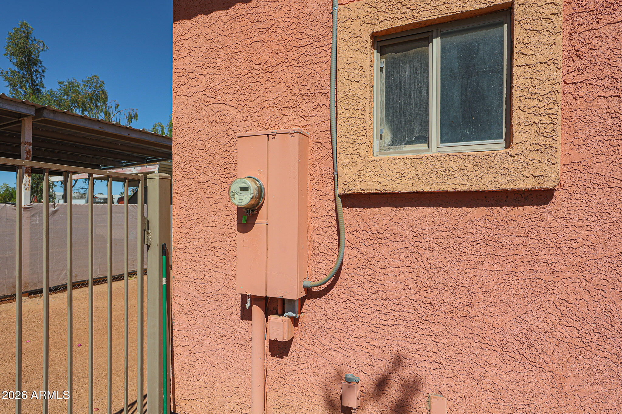 7344 North Alsup Road Litchfield Park, AZ 85340 - Photo 44 of 62 a view of a brick house with a door
