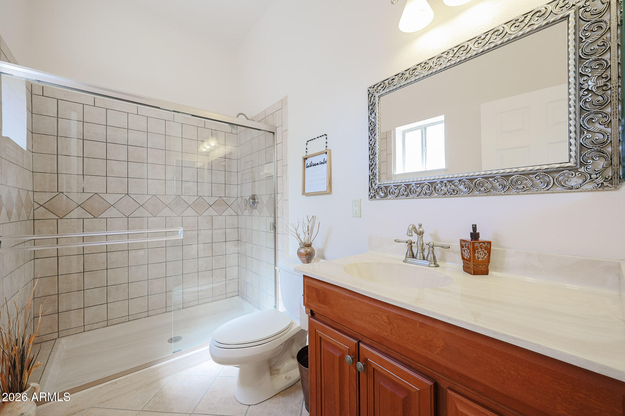 7344 North Alsup Road Litchfield Park, AZ 85340 - Photo 47 of 62 a bathroom with a sink a toilet and shower