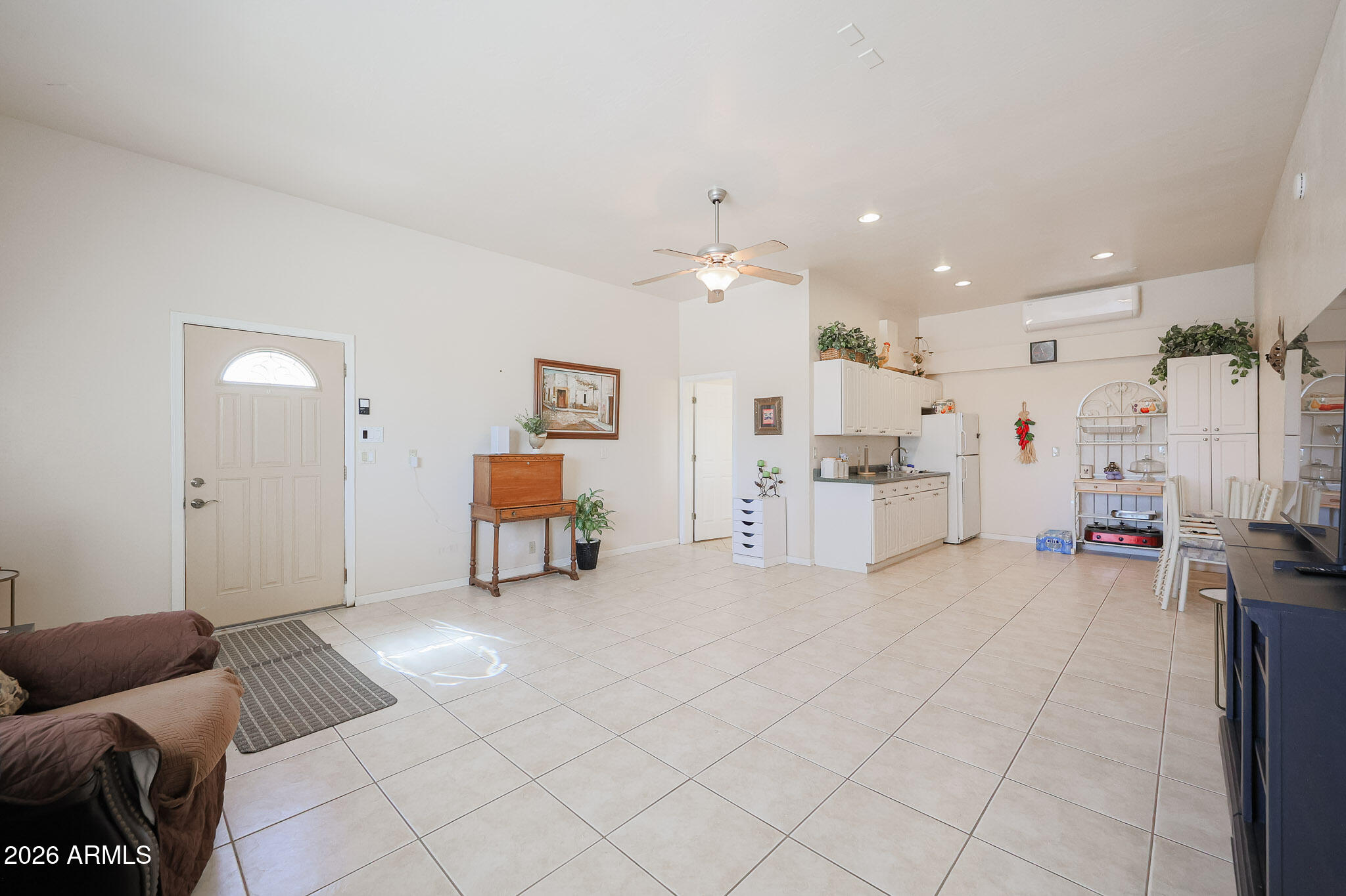 7344 North Alsup Road Litchfield Park, AZ 85340 - Photo 48 of 62 a living room with furniture and kitchen view