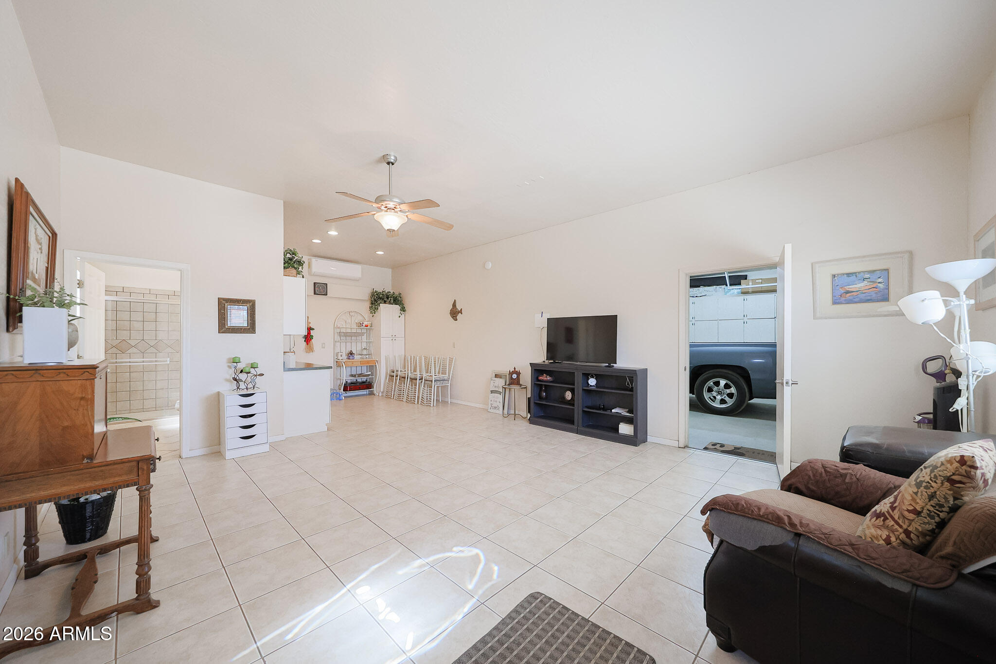 7344 North Alsup Road Litchfield Park, AZ 85340 - Photo 49 of 62 a living room with furniture and a fireplace