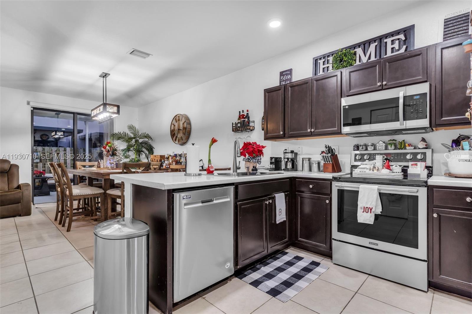 11424 Southwest 251st Street Homestead, FL 33032 - Photo 11 of 43 a kitchen with a sink and cabinets