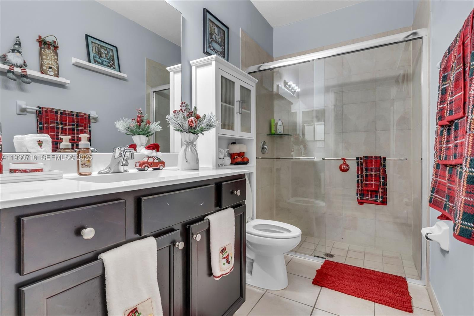 11424 Southwest 251st Street Homestead, FL 33032 - Photo 15 of 43 a bathroom with a sink toilet and shower