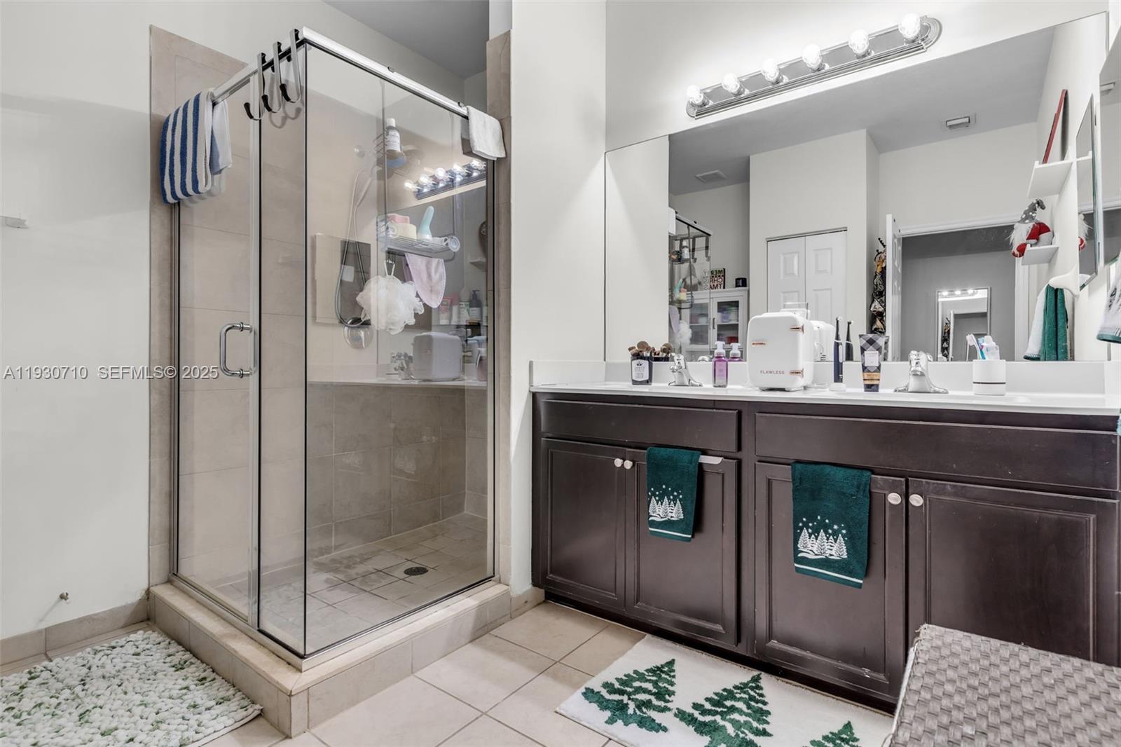 11424 Southwest 251st Street Homestead, FL 33032 - Photo 18 of 43 a bathroom with a shower a sink and a mirror