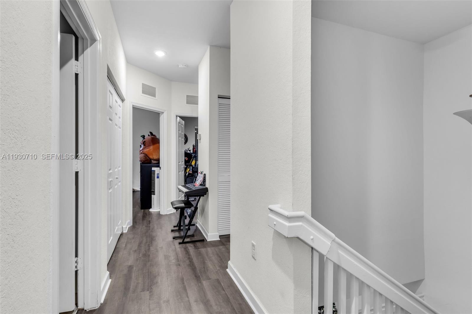 11424 Southwest 251st Street Homestead, FL 33032 - Photo 28 of 43 a view of a hallway with a hardwood floor