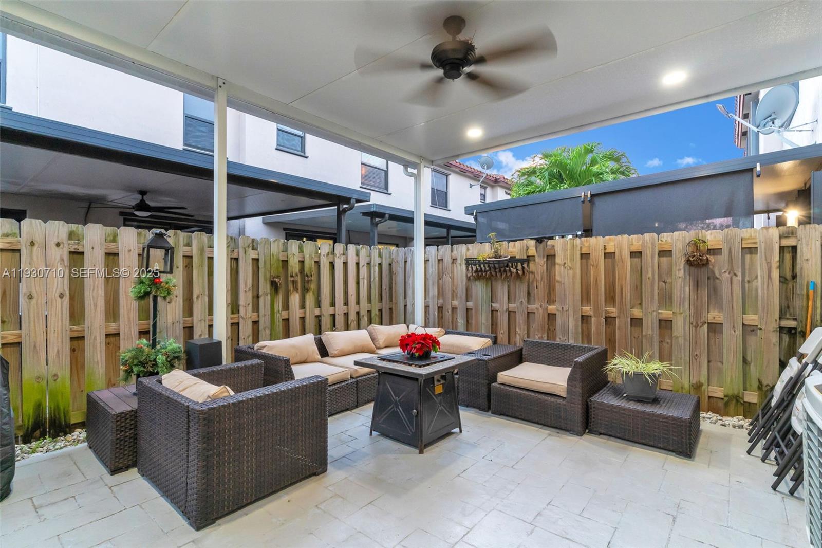 11424 Southwest 251st Street Homestead, FL 33032 - Photo 30 of 43 a outdoor space with patio furniture and a fireplace