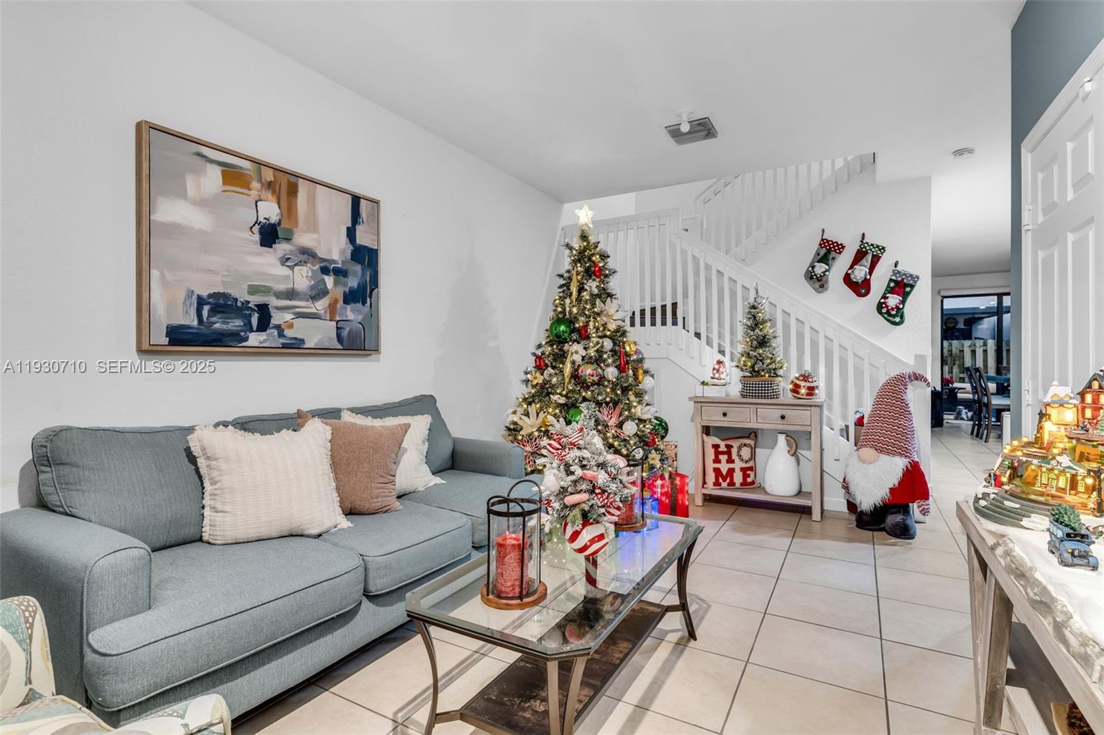 11424 Southwest 251st Street Homestead, FL 33032 - Photo 4 of 43 a living room with furniture and a potted plant