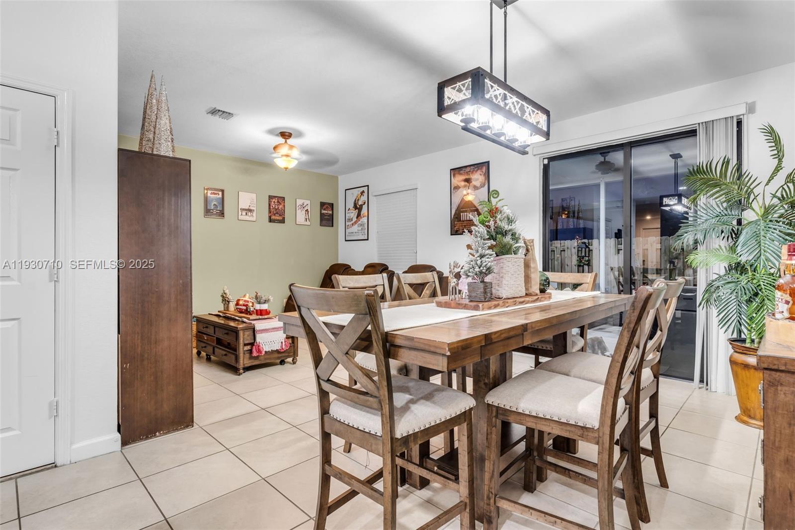 11424 Southwest 251st Street Homestead, FL 33032 - Photo 9 of 43 a view of a dining room with furniture