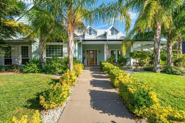 a large kitchen with stainless steel appliances lots of counter space and breakfast area