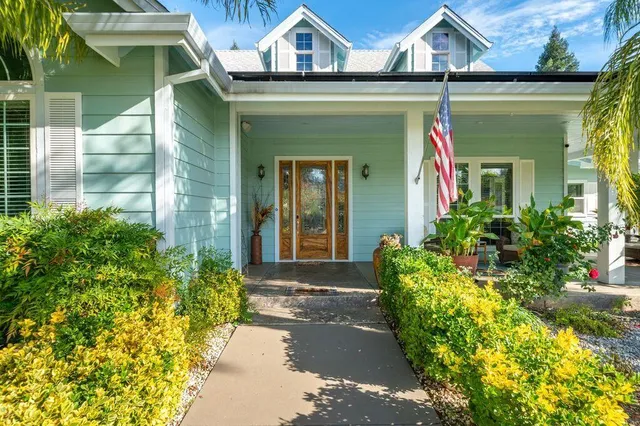 a large kitchen with stainless steel appliances kitchen island granite countertop a large kitchen island a stove and a sink