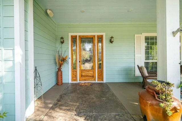 a kitchen with kitchen island granite countertop a stove and a sink