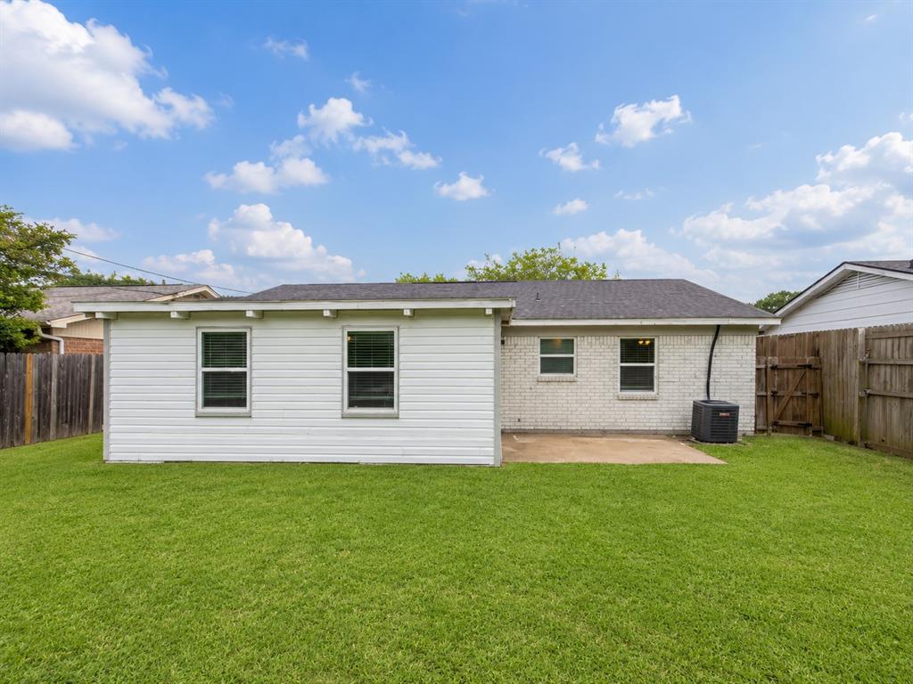 1231 Rutherford Drive Mesquite, TX 75149 - Photo 27 of 29 a view of a house with a yard and pathway
