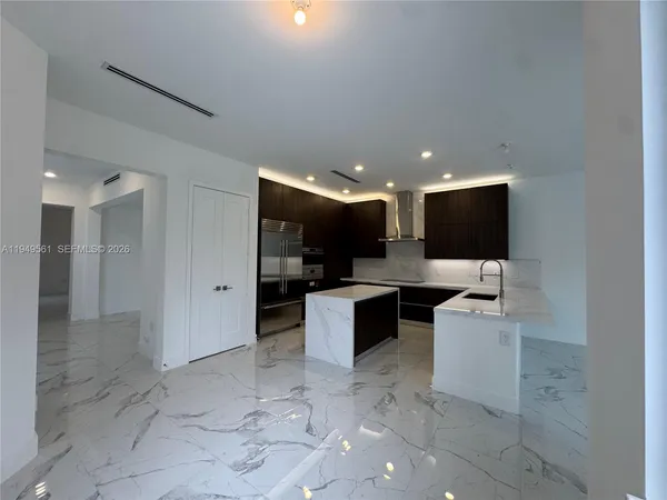 a bathroom with a sink shower and a toilet