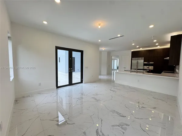 a utility room with cabinets washer and dryer