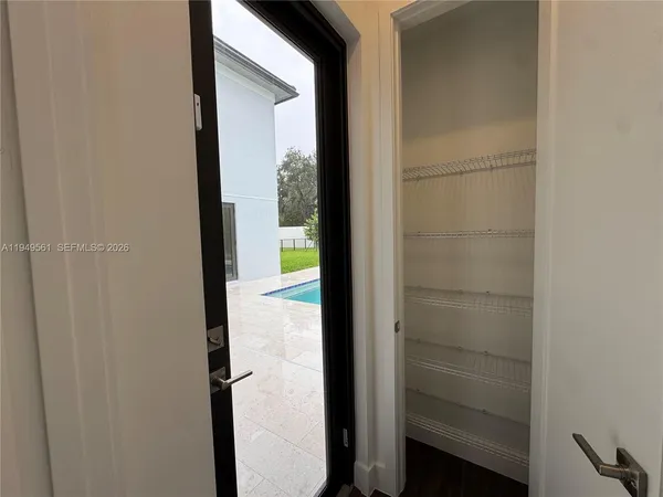 a en suite bathroom with a sink double vanity and mirror