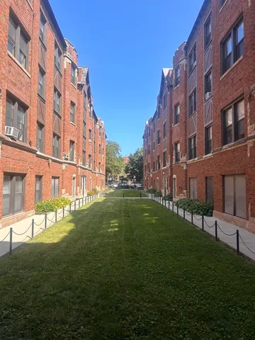 a view of a building with a yard