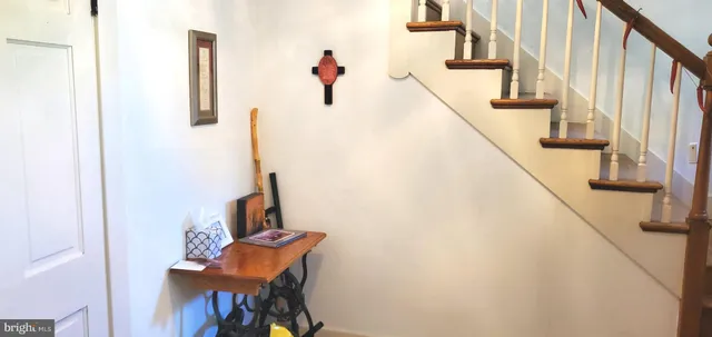 a bedroom with bed and wooden floor