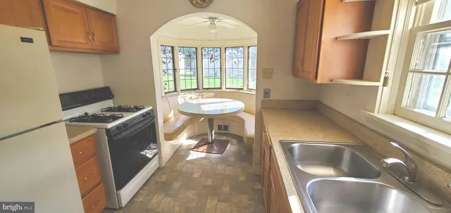 a bathroom with a sink and a window