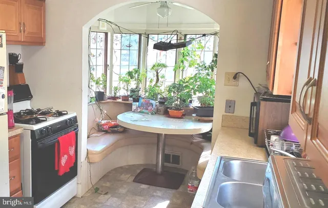 a view of a room with wooden floor and a window