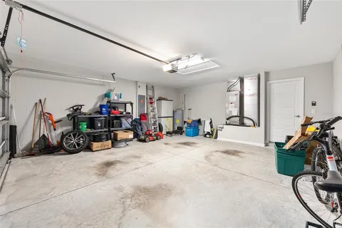 a view of a garage with a bike and a water heater