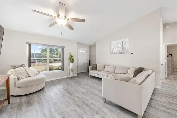 a living room with furniture and a large window