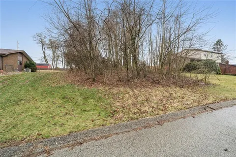 a view of a backyard of the house