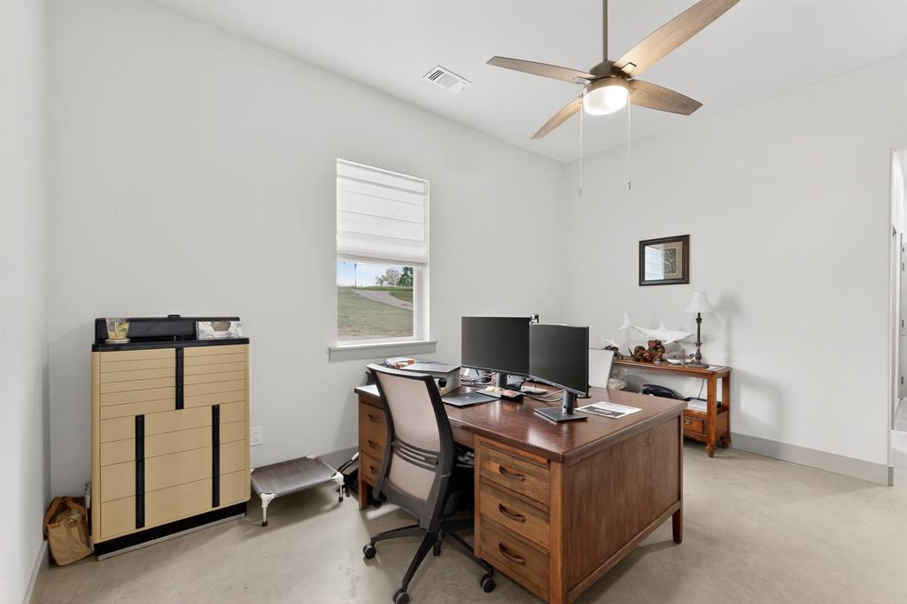 613 Kentucky Town Road Whitewright, TX 75491 - Photo 23 of 39 a view of a workspace with furniture