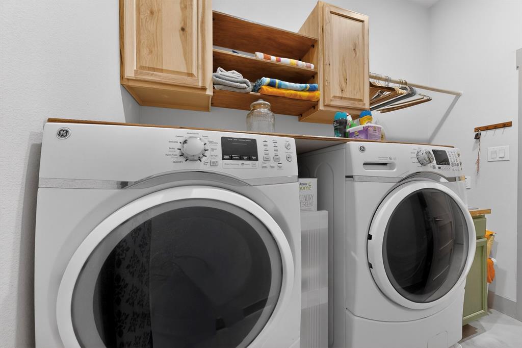 613 Kentucky Town Road Whitewright, TX 75491 - Photo 26 of 39 a utility room with dryer and washer