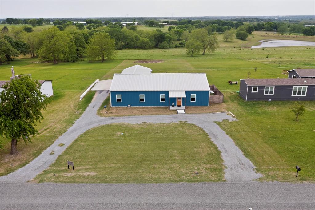 613 Kentucky Town Road Whitewright, TX 75491 - Photo 3 of 39 an aerial view of a house with a yard swimming pool and outdoor seating
