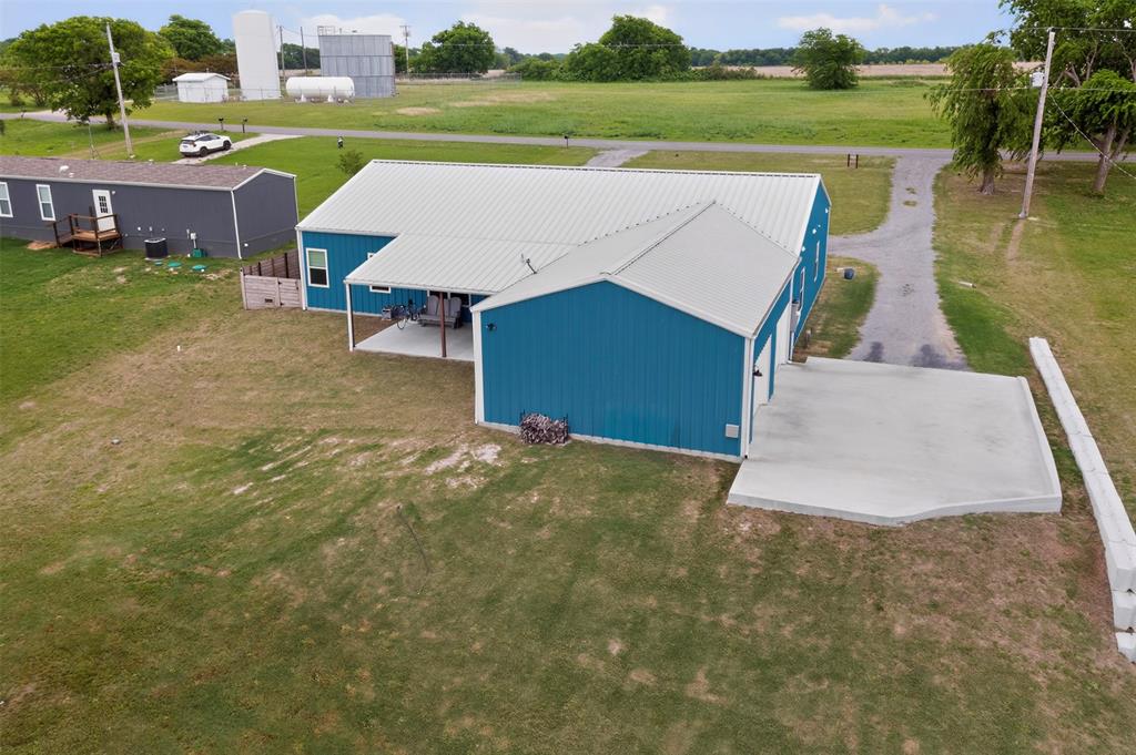 613 Kentucky Town Road Whitewright, TX 75491 - Photo 35 of 39 a view of a big yard with an outdoor seating