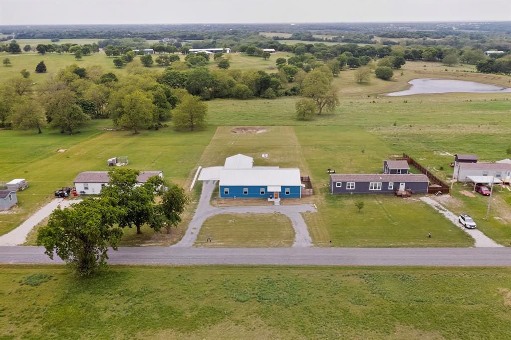 613 Kentucky Town Road Whitewright, TX 75491 - Photo 4 of 39 an aerial view of a house with a lake view