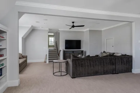 a bedroom with a bed and flat screen tv