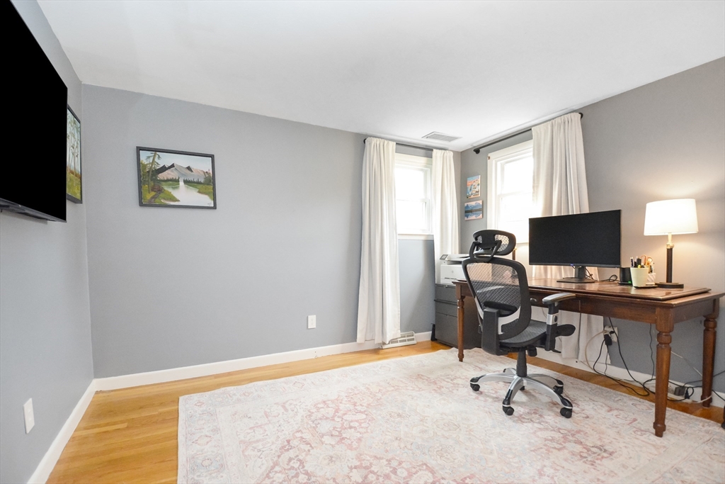 360 High Street Whitman, MA 02382 - Photo 11 of 33 a view of a livingroom with workspace and a window