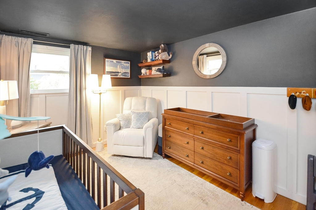 360 High Street Whitman, MA 02382 - Photo 14 of 33 a room with wooden floors and stairs