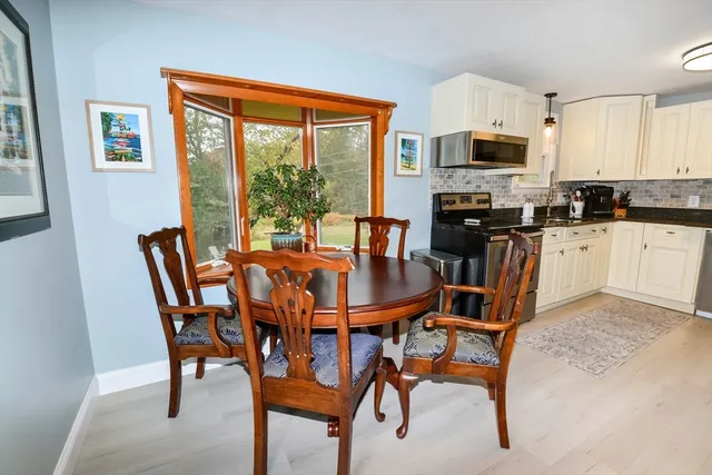 a view of a dining room with furniture window and outside view
