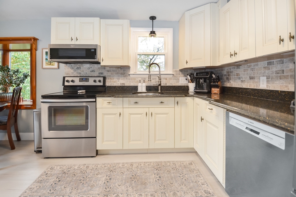 360 High Street Whitman, MA 02382 - Photo 7 of 33 a kitchen with granite countertop white cabinets and appliances