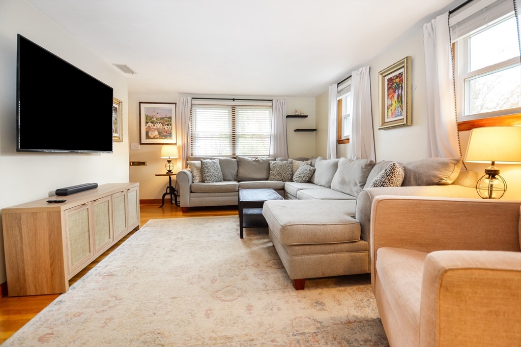 360 High Street Whitman, MA 02382 - Photo 8 of 33 a living room with furniture and a flat screen tv