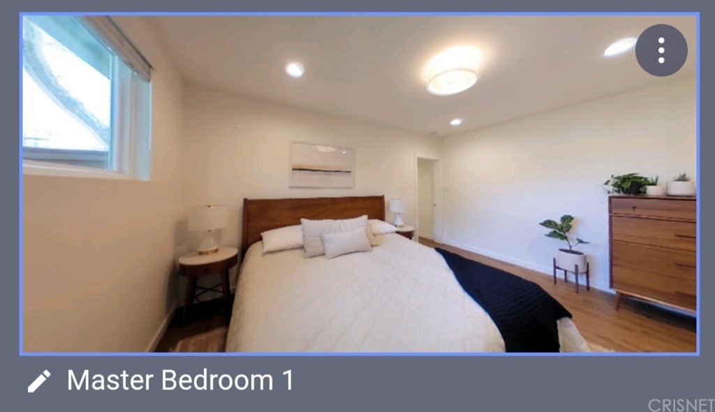 14721 Weddington Street Sherman Oaks, CA 91411 - Photo 11 of 17 a bed room with a bed and a television