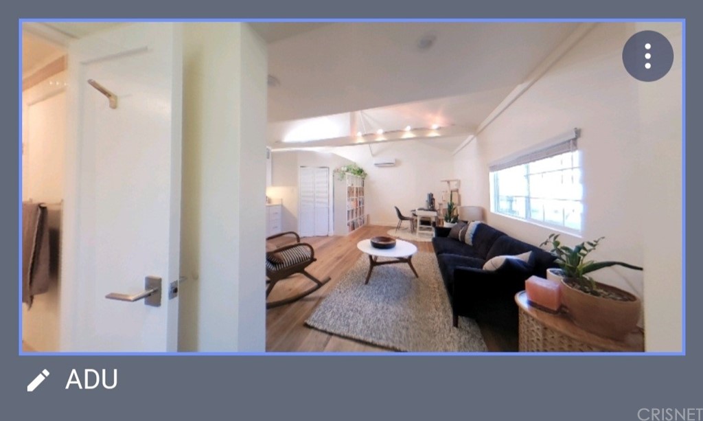 14721 Weddington Street Sherman Oaks, CA 91411 - Photo 13 of 17 a living room with furniture and a potted plant