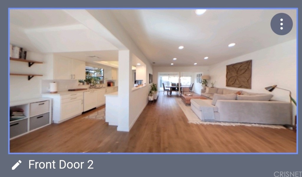 14721 Weddington Street Sherman Oaks, CA 91411 - Photo 4 of 17 a living room with kitchen island furniture and a wooden floor