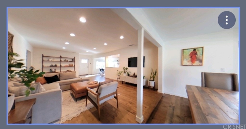 14721 Weddington Street Sherman Oaks, CA 91411 - Photo 7 of 17 a living room with furniture and a wooden floor