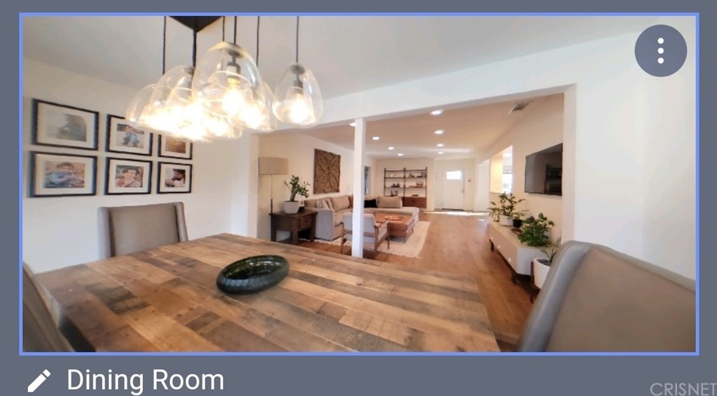 14721 Weddington Street Sherman Oaks, CA 91411 - Photo 8 of 17 a view of a dining room with furniture and a chandelier
