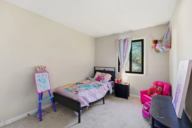 a bedroom with furniture and a bed