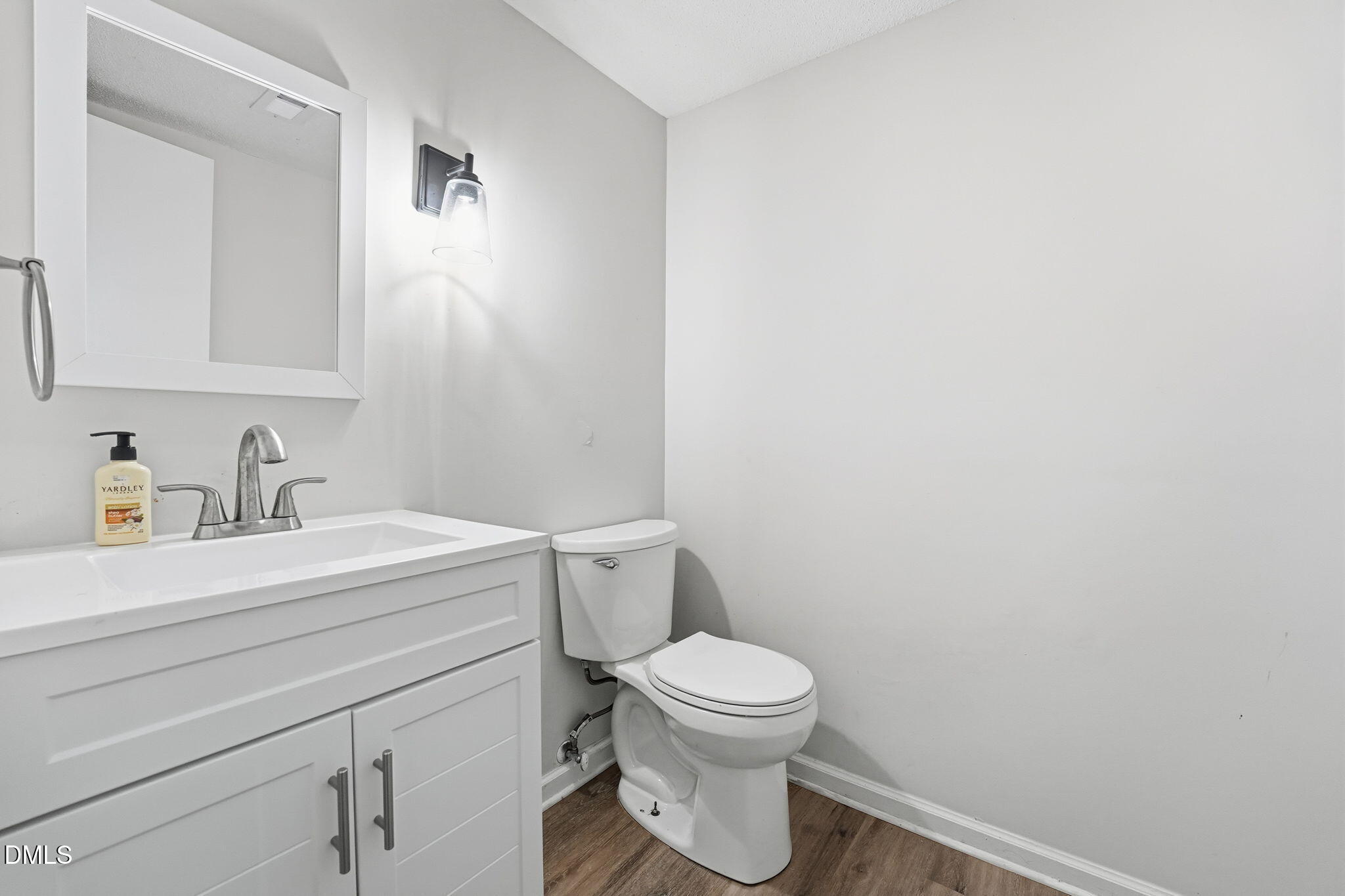 617 Springview Trail Garner, NC 27529 - Photo 20 of 25 a bathroom with a sink a toilet and mirror