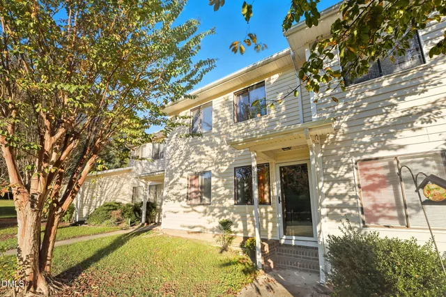 a view of a building with a tree