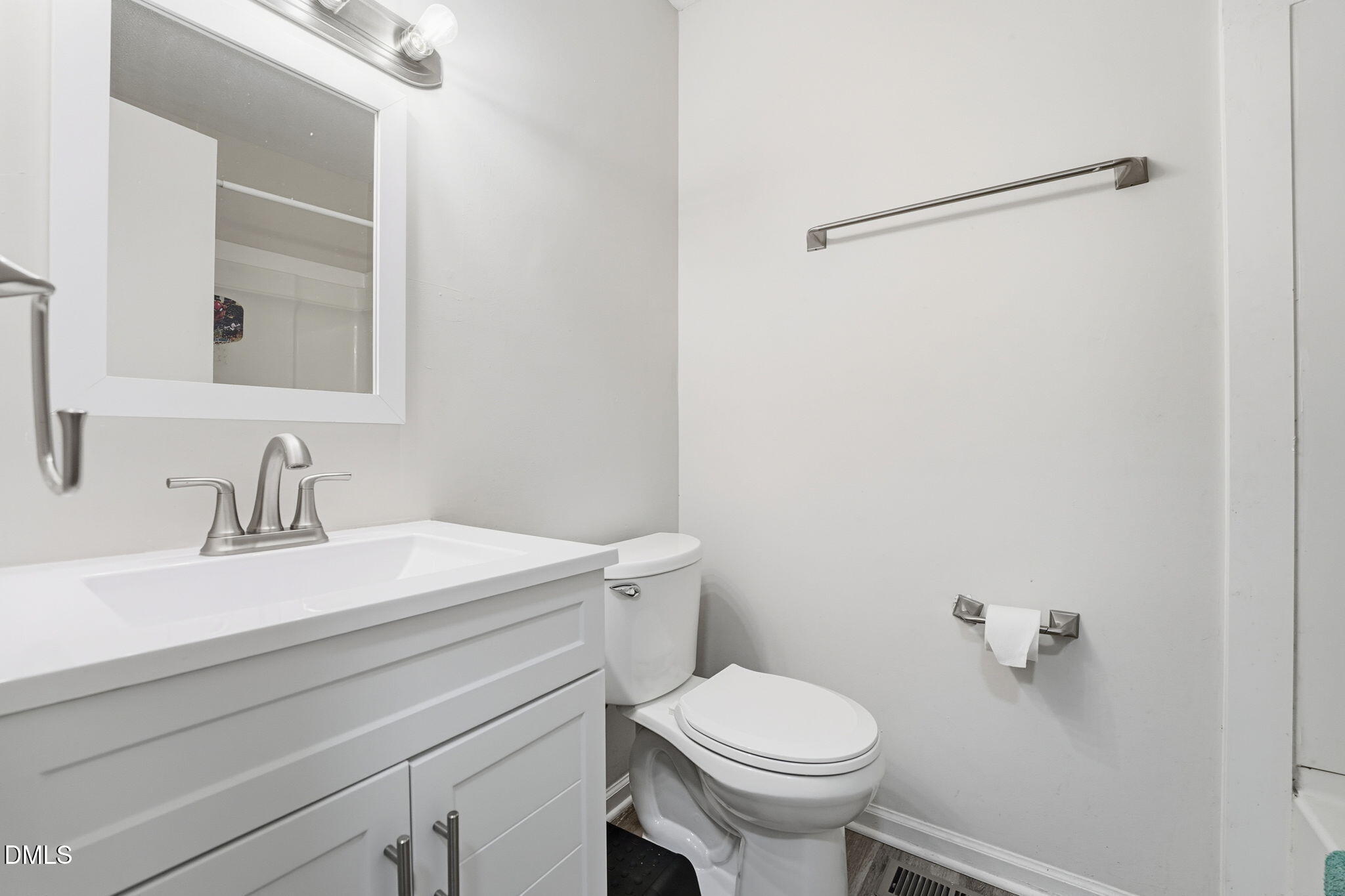 617 Springview Trail Garner, NC 27529 - Photo 21 of 25 a bathroom with a sink a toilet and a mirror