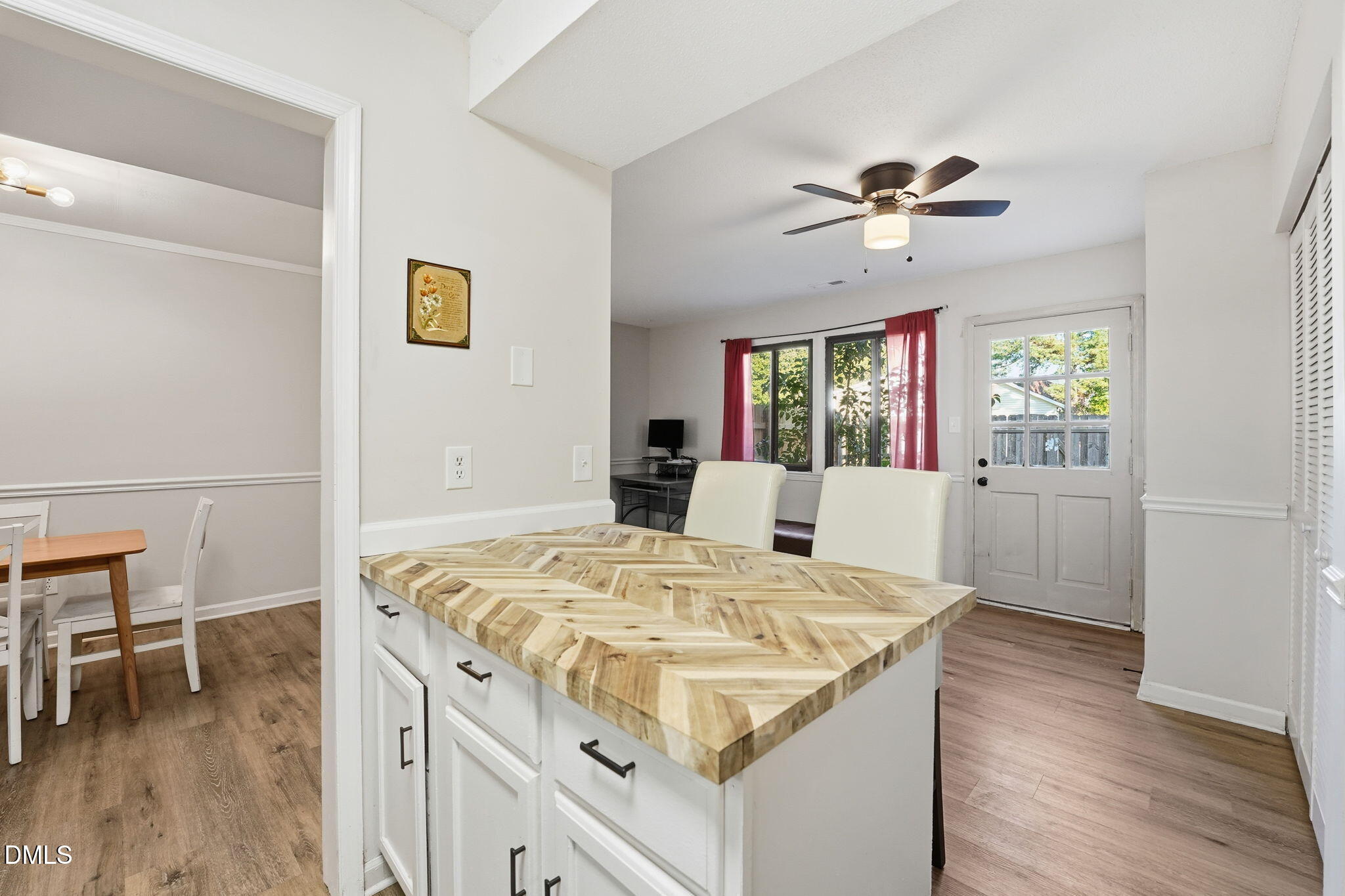 617 Springview Trail Garner, NC 27529 - Photo 4 of 25 a view of kitchen island with cabinets and wooden floor