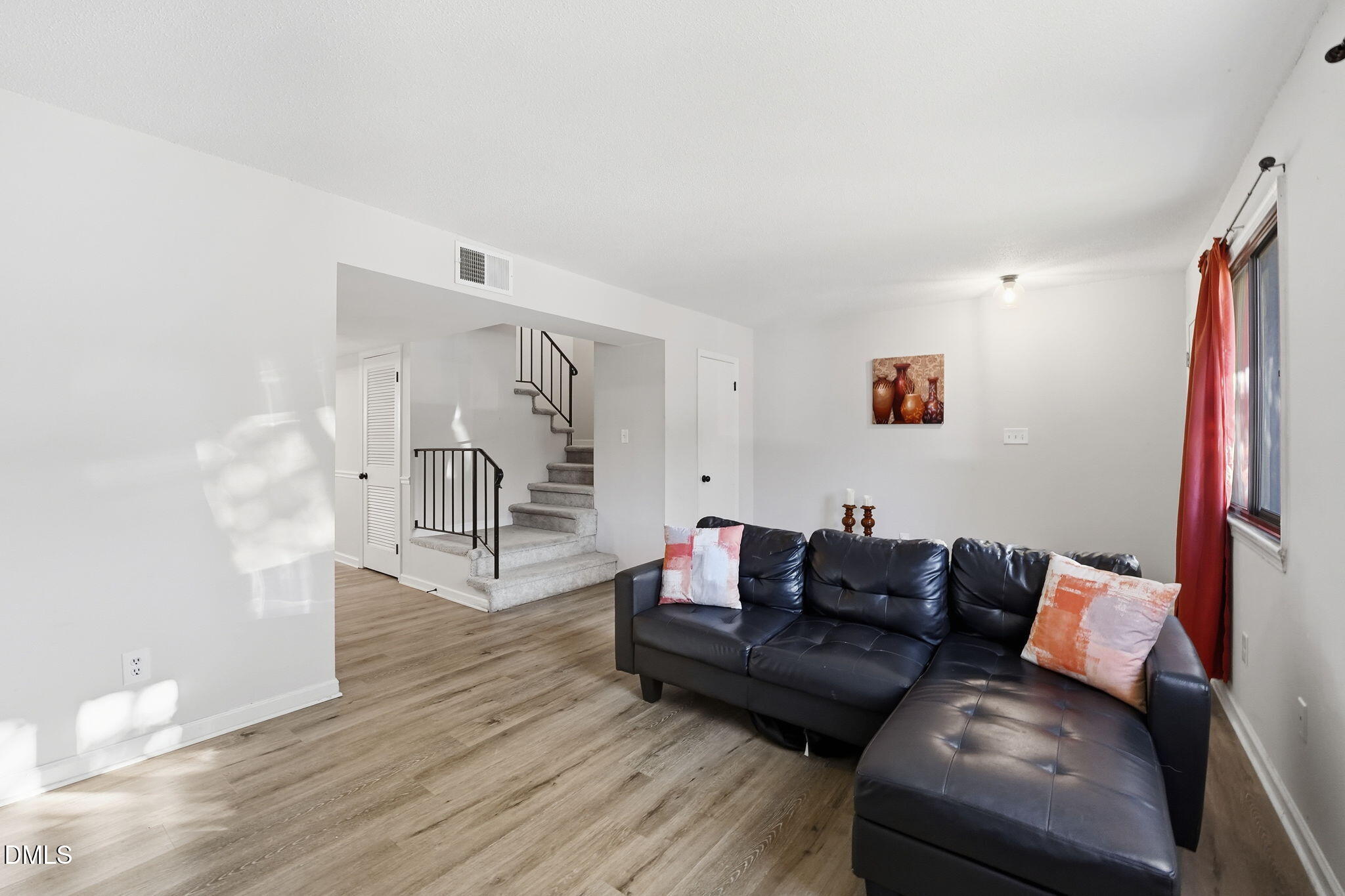 617 Springview Trail Garner, NC 27529 - Photo 8 of 25 a living room with furniture and a wooden floor