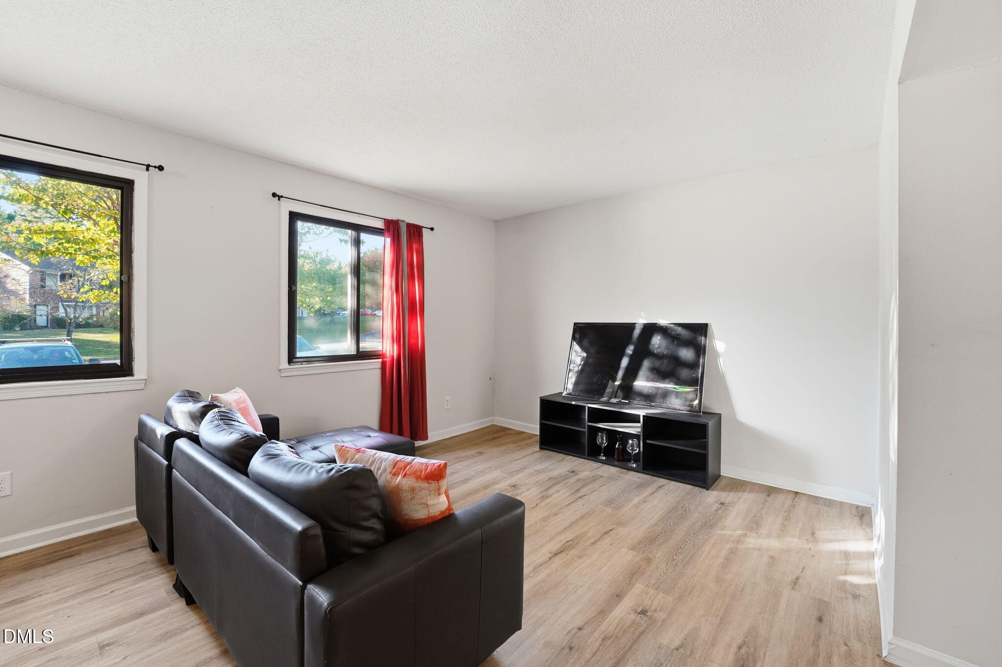 617 Springview Trail Garner, NC 27529 - Photo 10 of 25 a living room with furniture and a flat screen tv