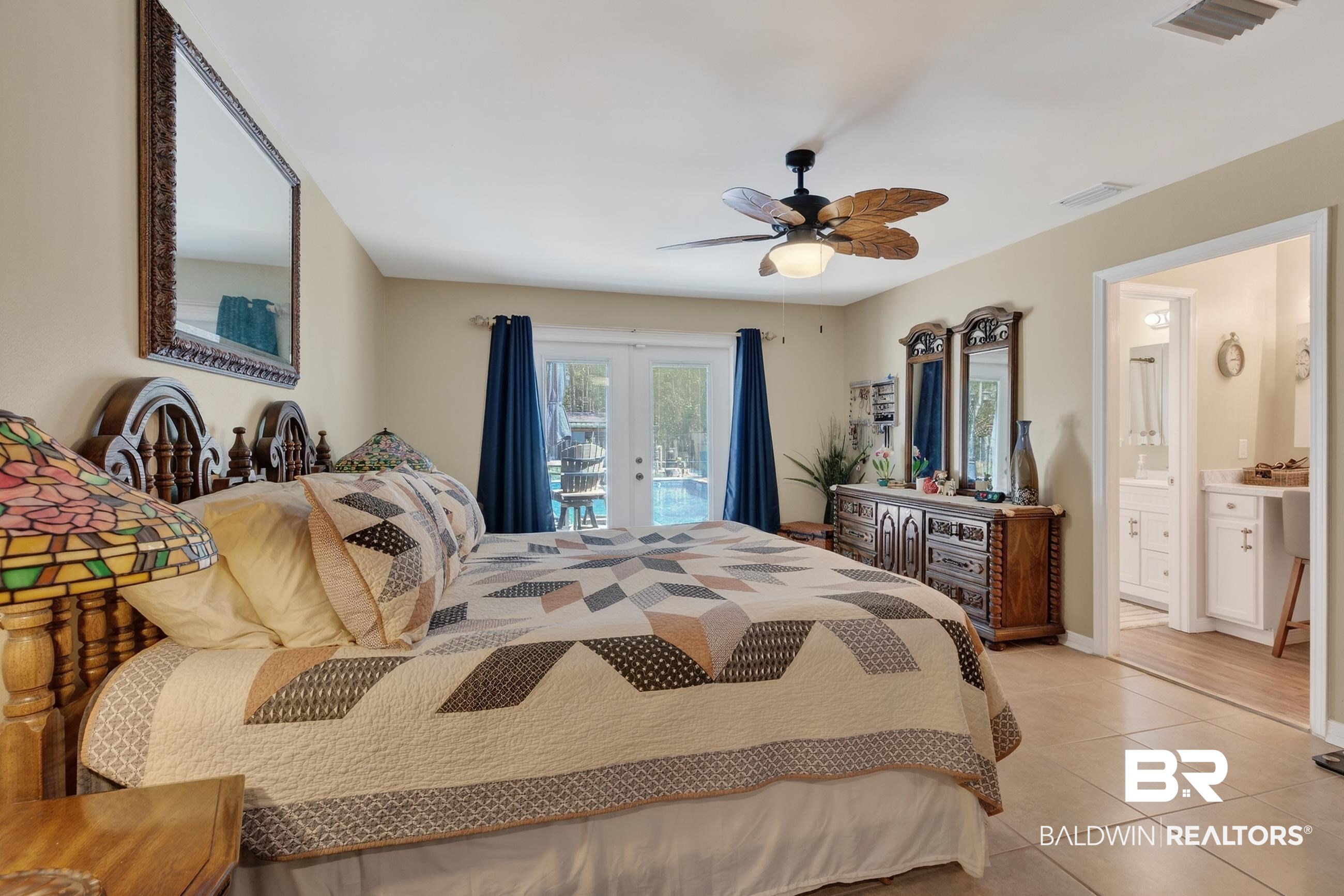 1271 Spring Valley Drive South Mobile, AL 36693 - Photo 31 of 56 Bedroom with french doors, access to outside, ceiling fan, ensuite bath, and light tile patterned floors